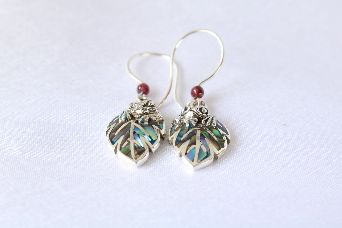 Frog on a leaf pendant earrings. Silver, abalone shell, garnets.