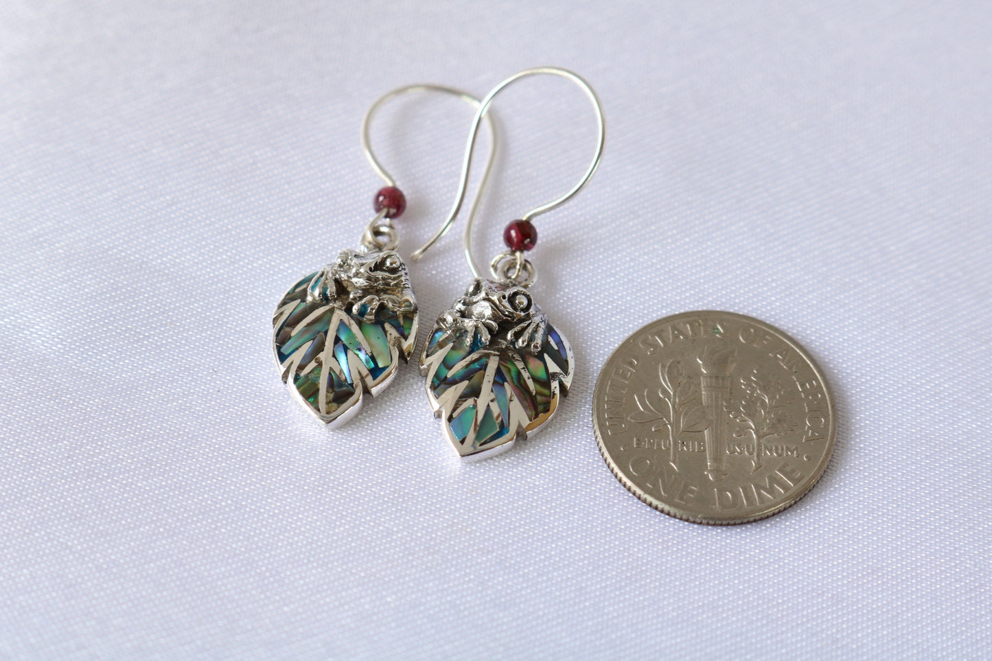 Frog on a leaf pendant earrings. Silver, abalone shell, garnets.