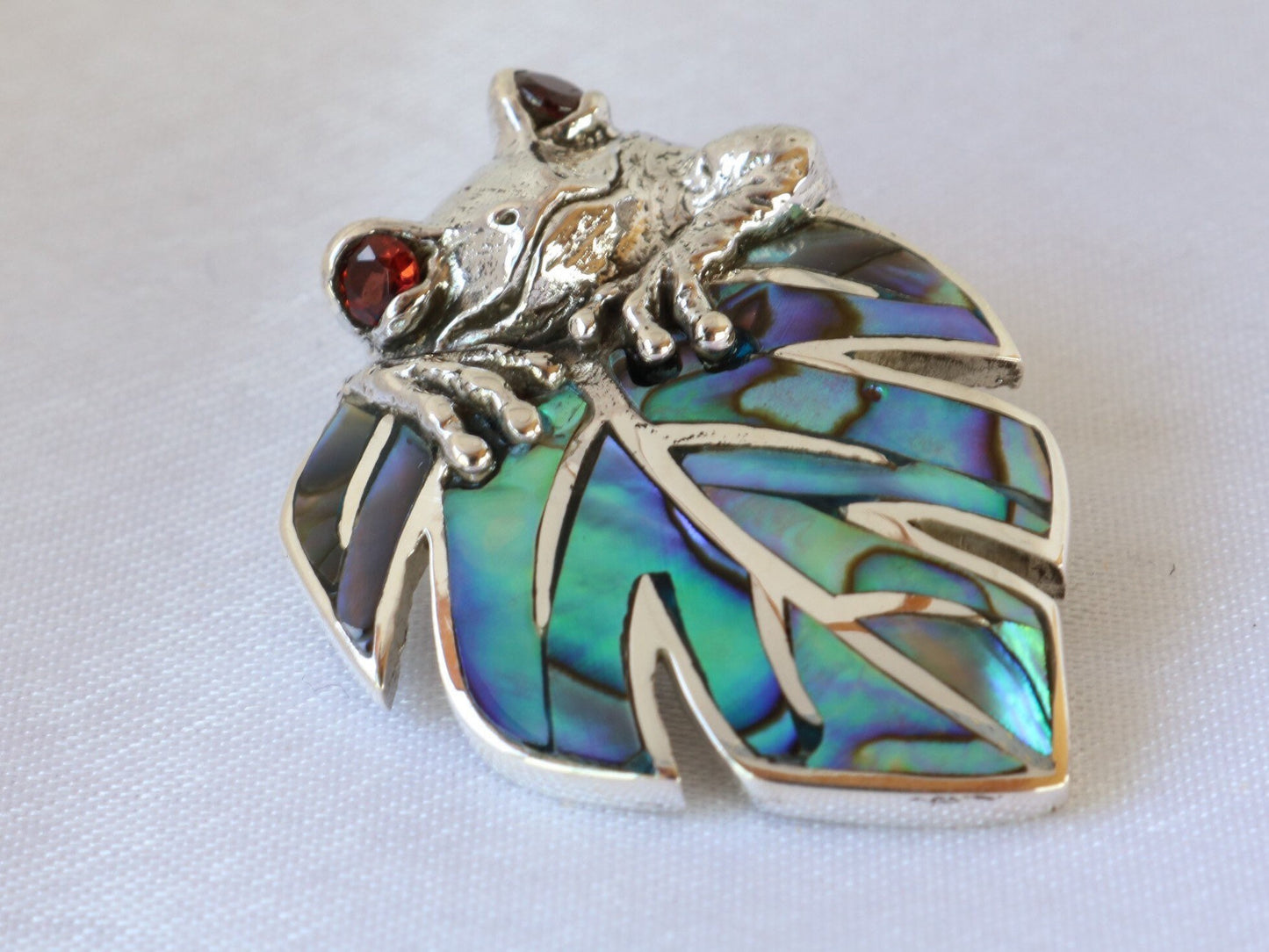 Frog on a leaf pendant necklace. Silver, abalone shell and garnet eyes.