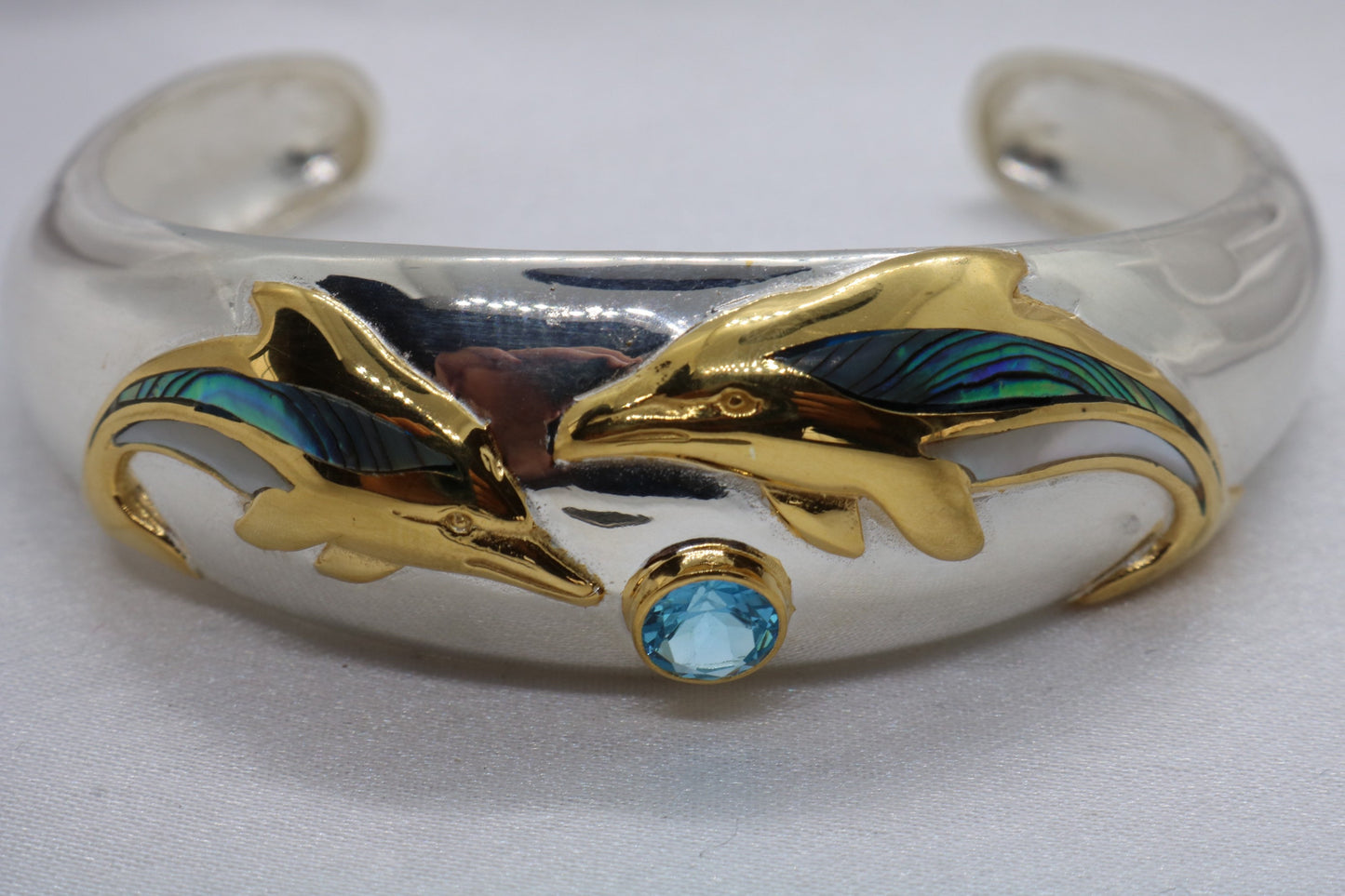 Aumakua dolphin Naia topaz cuff bracelet. Abalone shell, gold, silver.