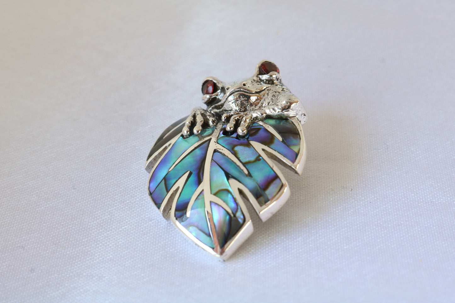 Frog on a leaf pendant necklace. Silver, abalone shell and garnet eyes.