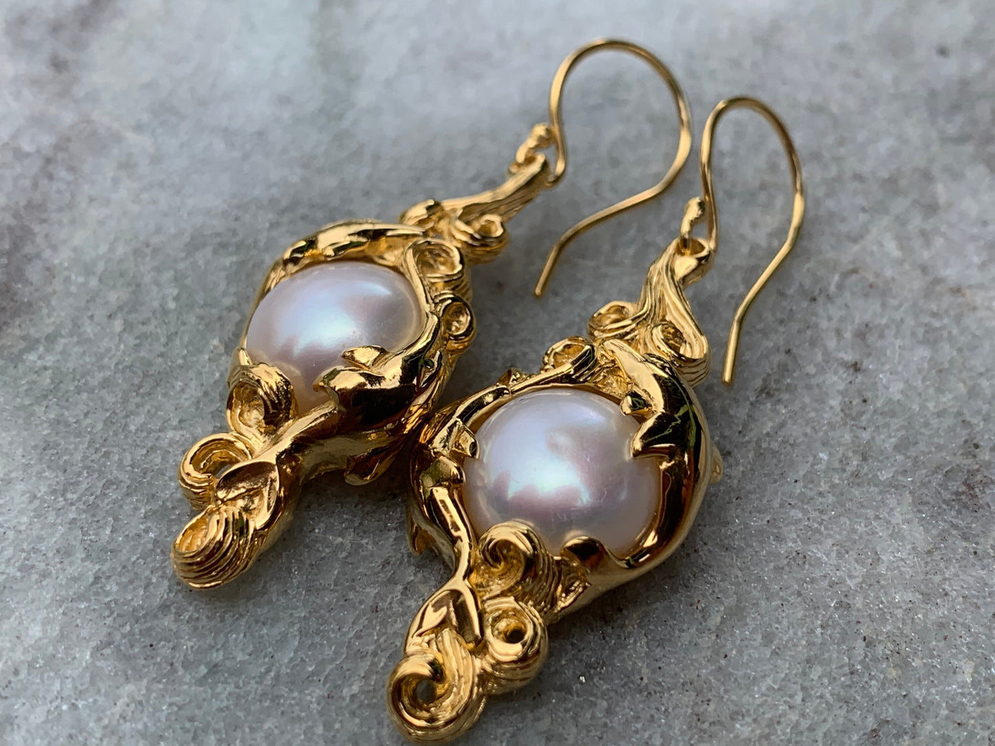 18k gold vermeil white mabe pearl dolphin earrings.