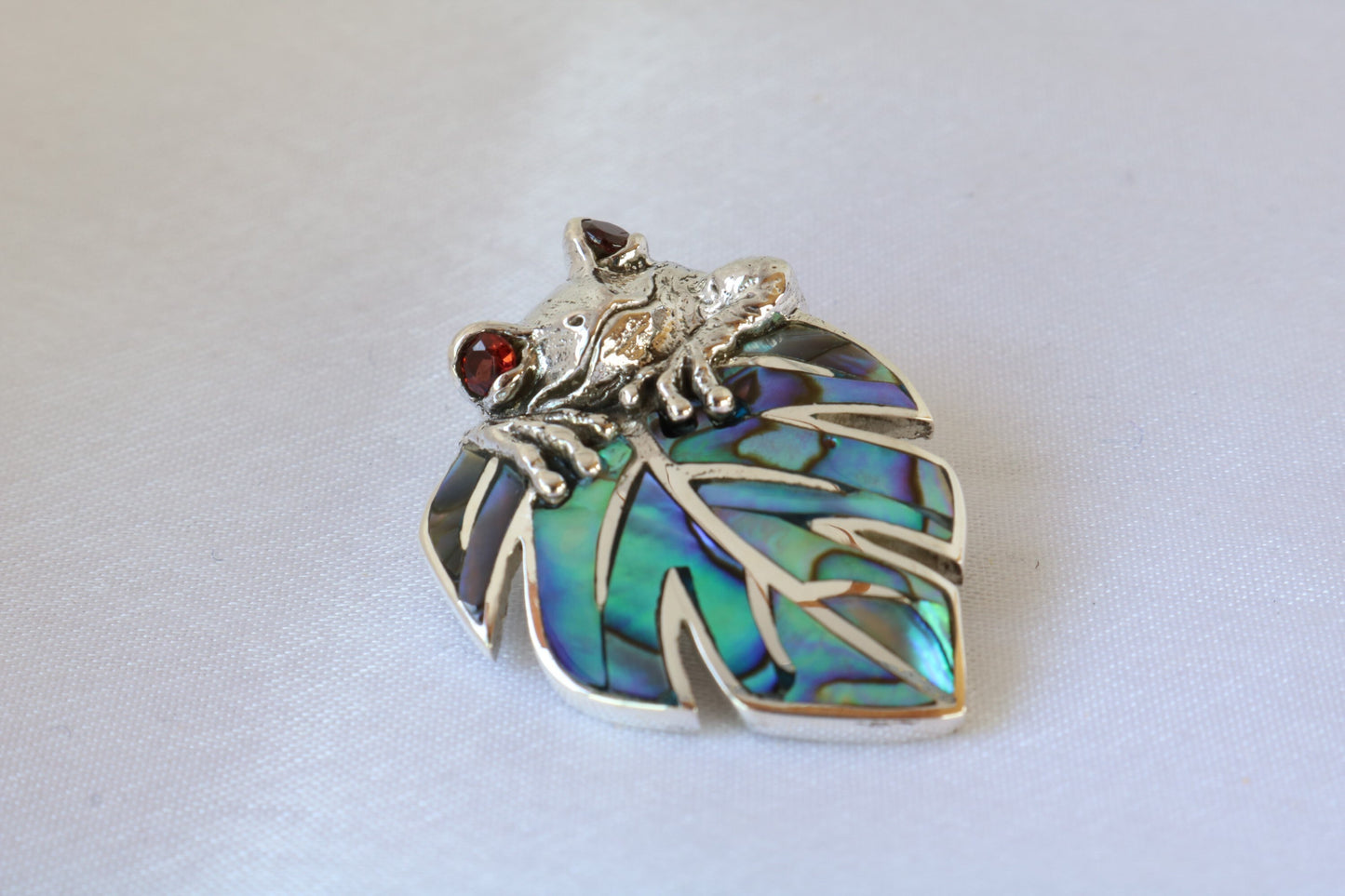Frog on a leaf pendant necklace. Silver, abalone shell and garnet eyes.