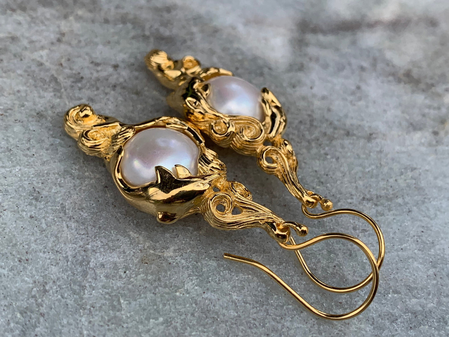 18k gold vermeil white mabe pearl dolphin earrings.