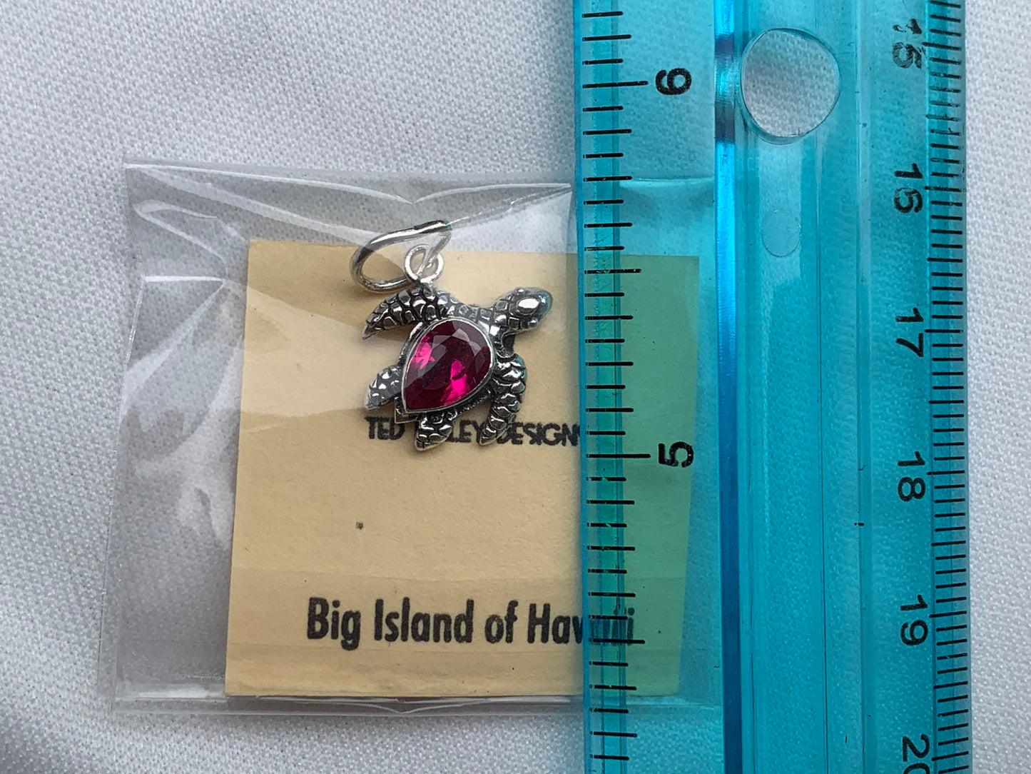Ruby turtle charm pendant necklace. Sterling silver.