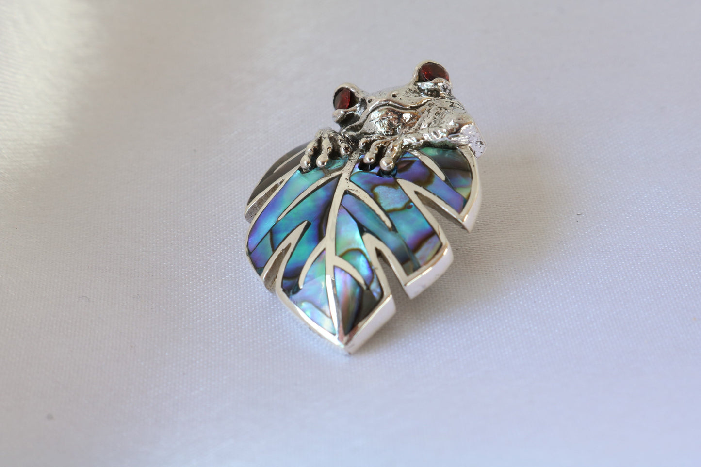 Frog on a leaf pendant necklace. Silver, abalone shell and garnet eyes.