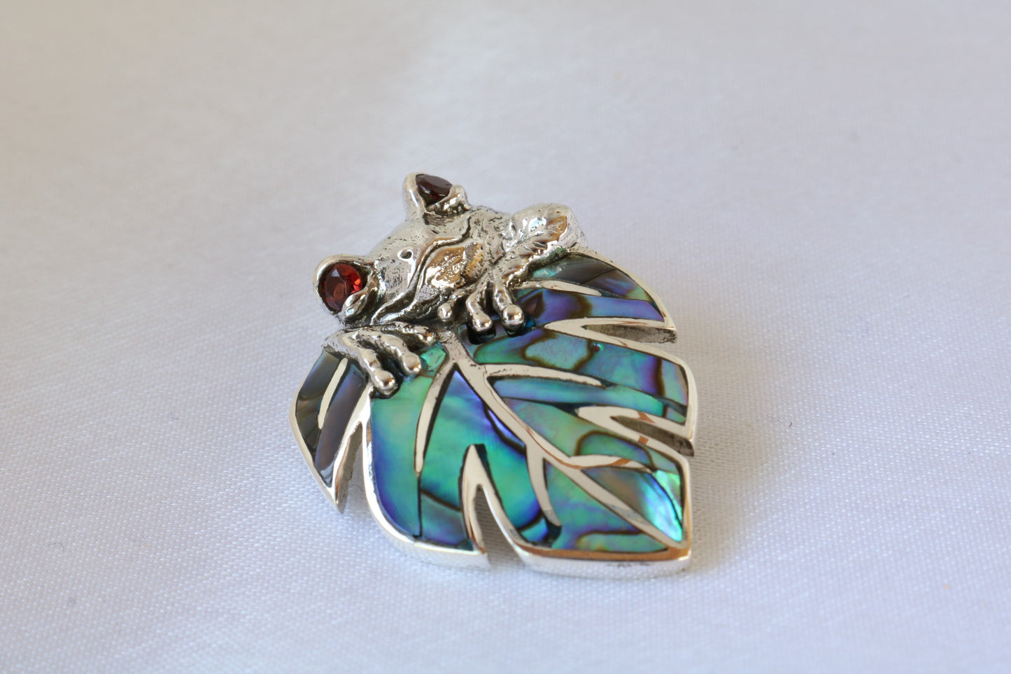 Frog on a leaf pendant necklace. Silver, abalone shell and garnet eyes.