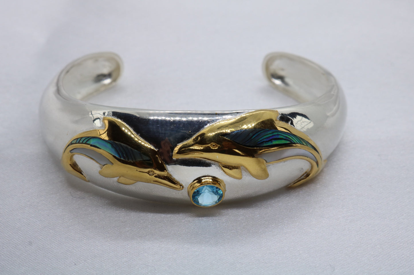 Aumakua dolphin Naia topaz cuff bracelet. Abalone shell, gold, silver.