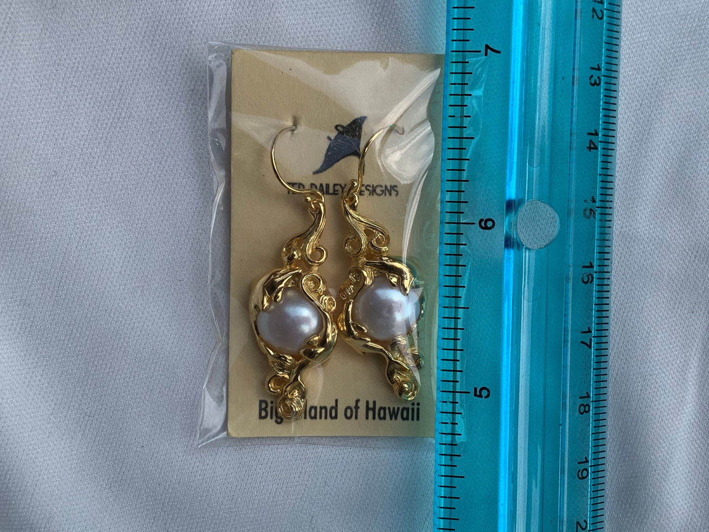 18k gold vermeil white mabe pearl dolphin earrings.
