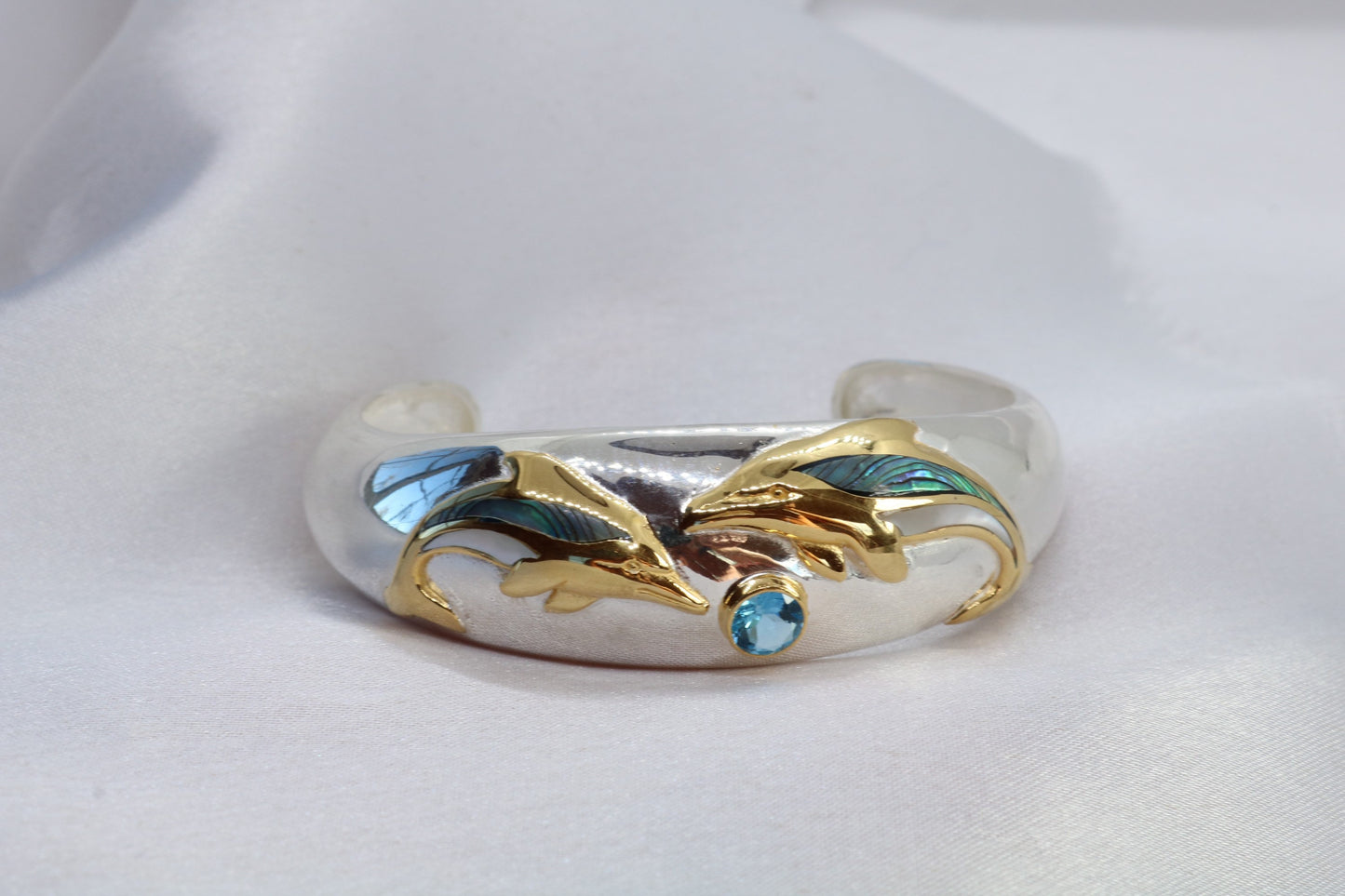 Aumakua dolphin Naia topaz cuff bracelet. Abalone shell, gold, silver.