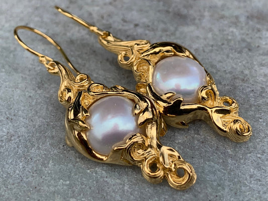 18k gold vermeil white mabe pearl dolphin earrings.