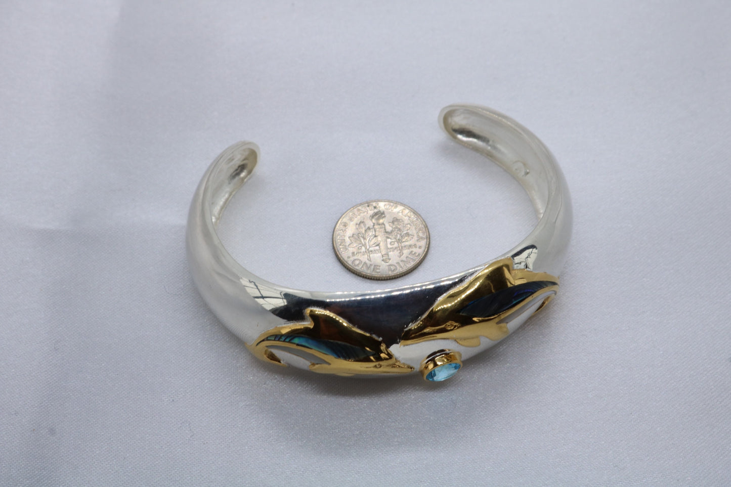 Aumakua dolphin Naia topaz cuff bracelet. Abalone shell, gold, silver.