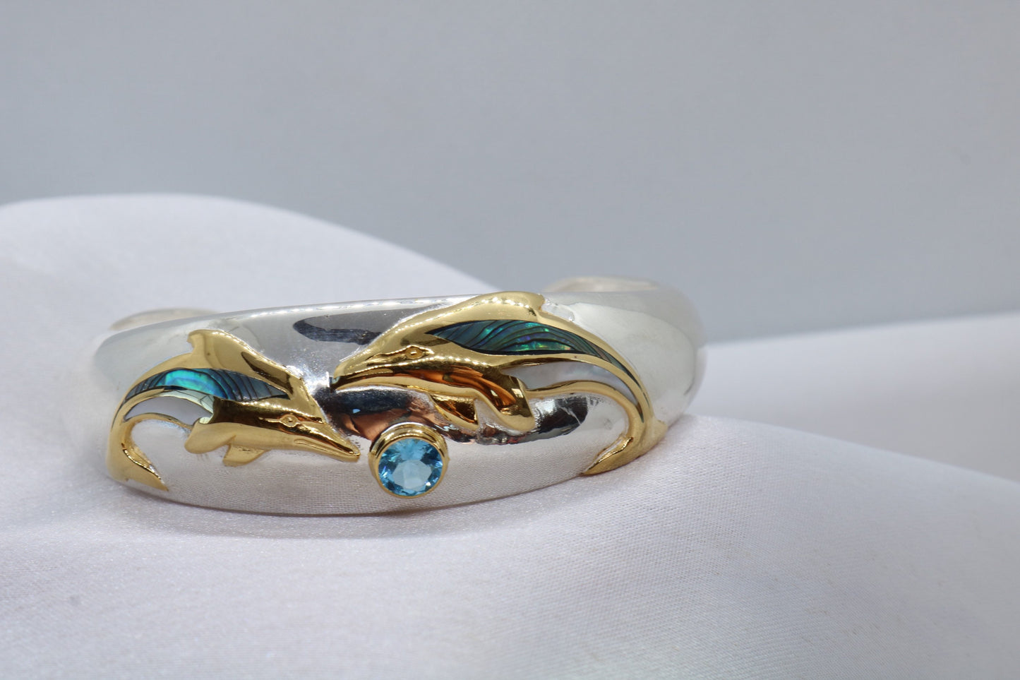 Aumakua dolphin Naia topaz cuff bracelet. Abalone shell, gold, silver.