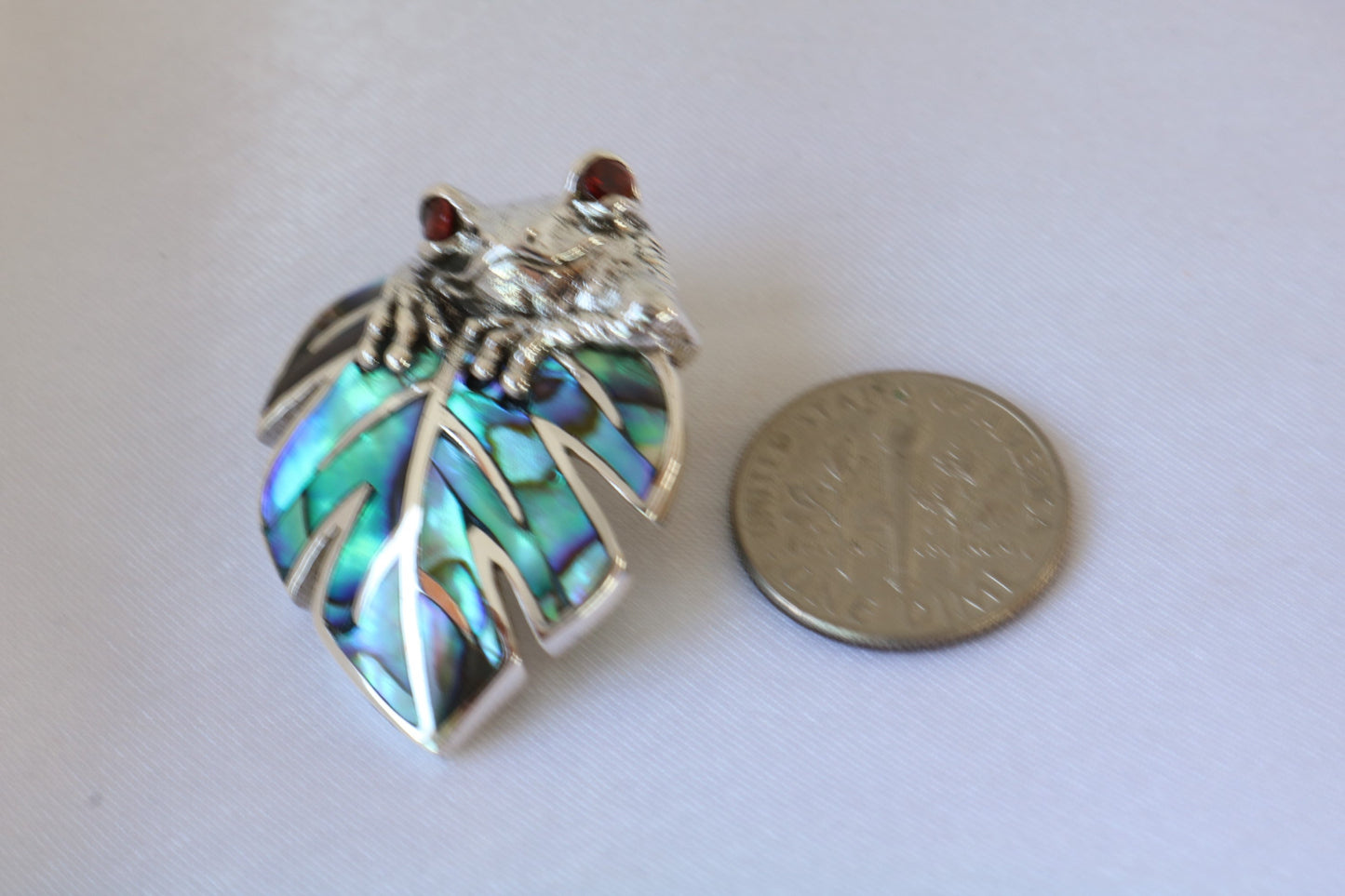 Frog on a leaf pendant necklace. Silver, abalone shell and garnet eyes.