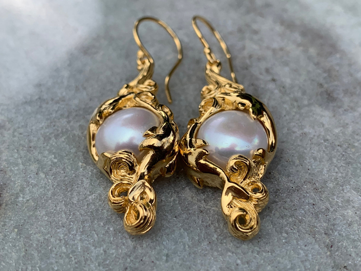 18k gold vermeil white mabe pearl dolphin earrings.