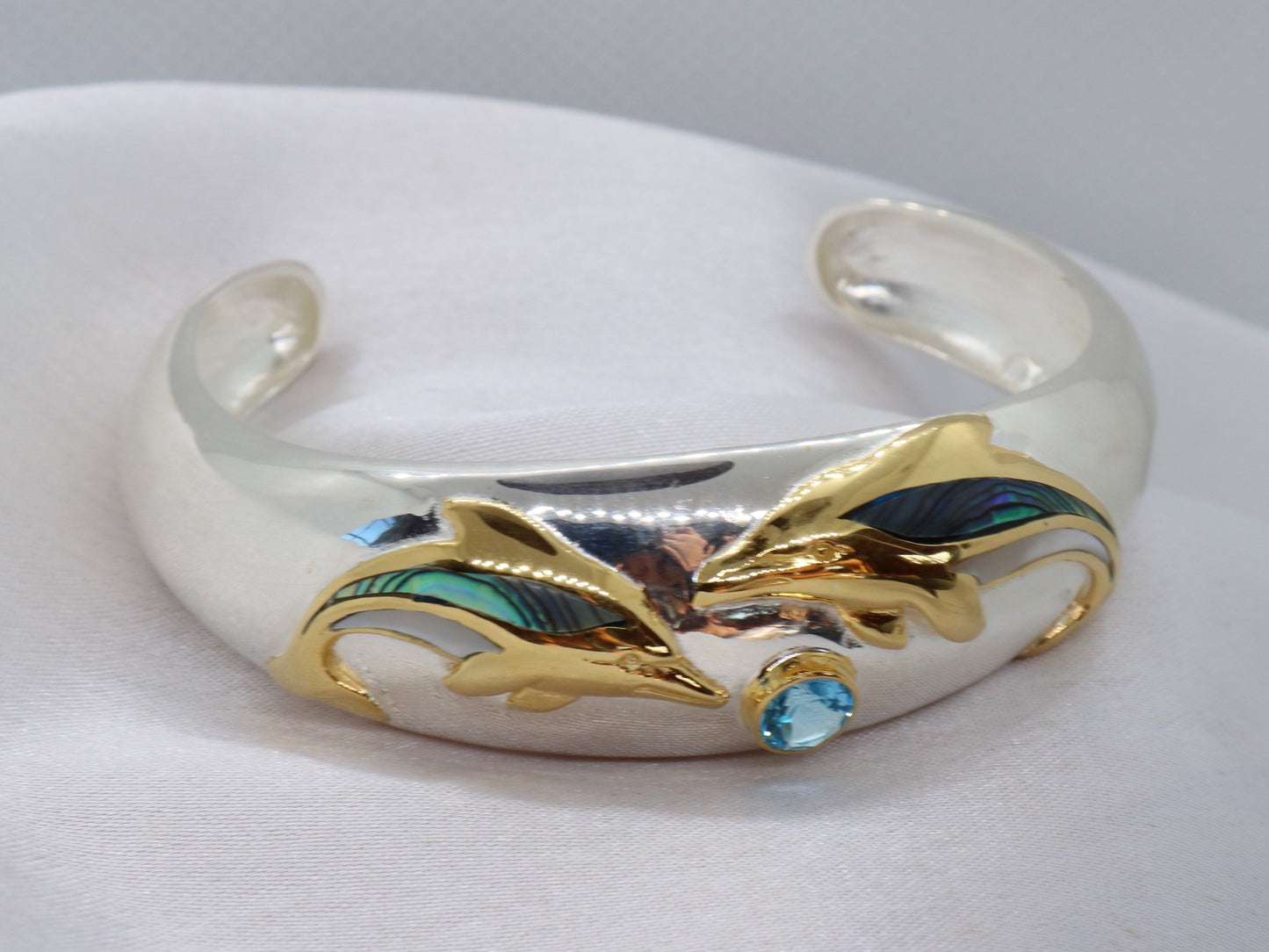 Aumakua dolphin Naia topaz cuff bracelet. Abalone shell, gold, silver.